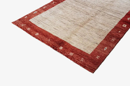 Gabbeh rug 200x133 cm, detail view: red border with ornamental patterns