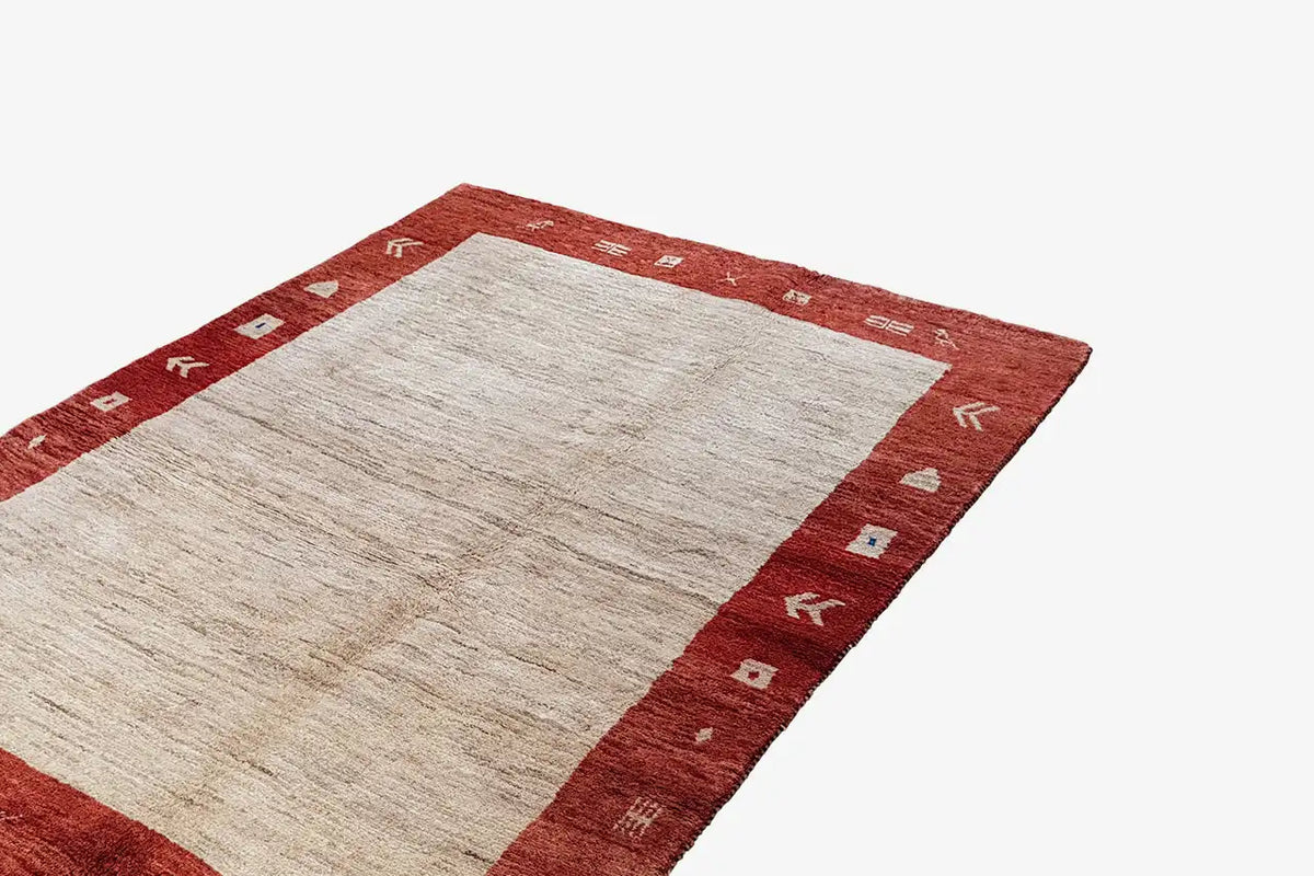 Gabbeh rug 200x133 cm, red border with geometric symbols and a light center