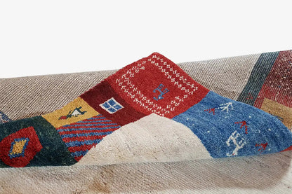 Gabbeh rug 210x149 cm Detail at the edge: blue and red ornaments in a patchwork design