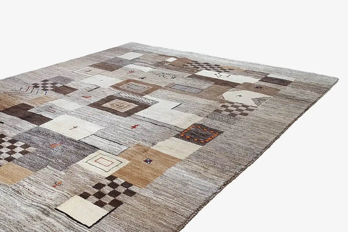 Rug with geometric squares and colorful accents in gray, beige, and brown