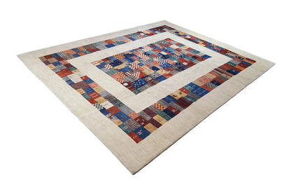 Pure wool rug with a centered patchwork medallion and wide border frame
