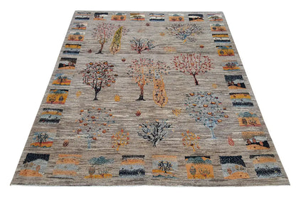 Carpet with tree designs and decorative border panels, multicolored, light background motif
