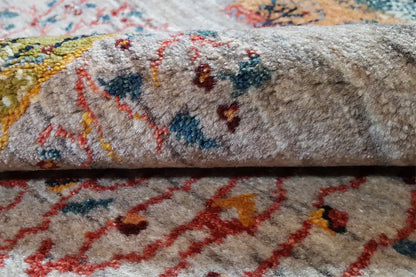 Close-up: carpet pile with multicolored patterns and a dense texture on a light background
