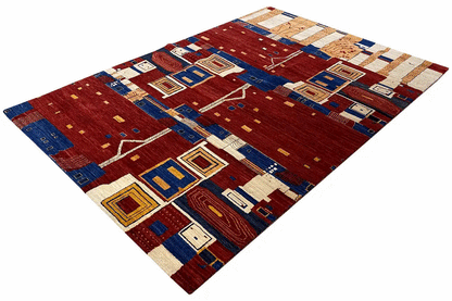 Gabbeh rug from above: geometric patterns in red and blue with beige areas