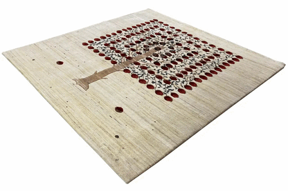 Gabbeh rug viewed diagonally with a red square motif and central tree symbol