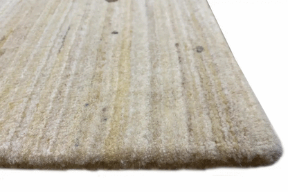 Close-up of a Gabbeh rug: light pile surface with a fine, even thread texture