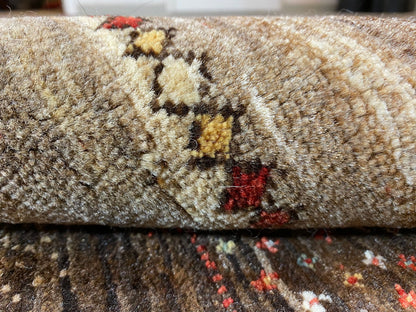 Carpet surface in detail: dense pile with beige, brown, and multicolored flecks