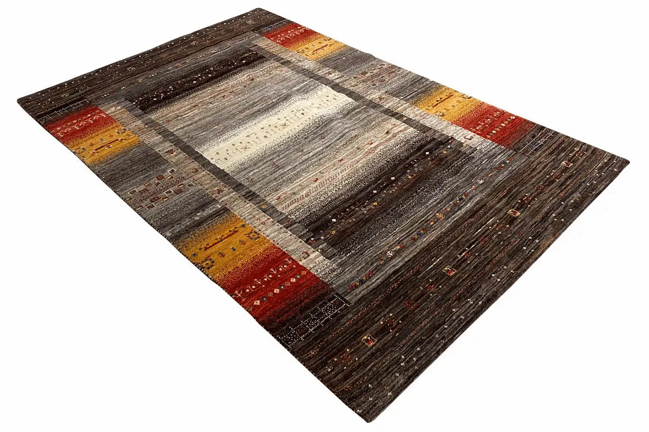 Gabbeh rug with a dark background, wide gray-and-white lines, and yellow-and-red framed stripes