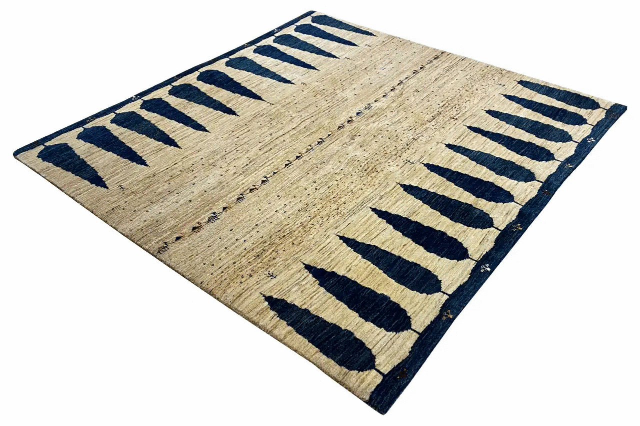 Gabbeh rug with a beige woven base and dark blue, diagonally arranged stripes