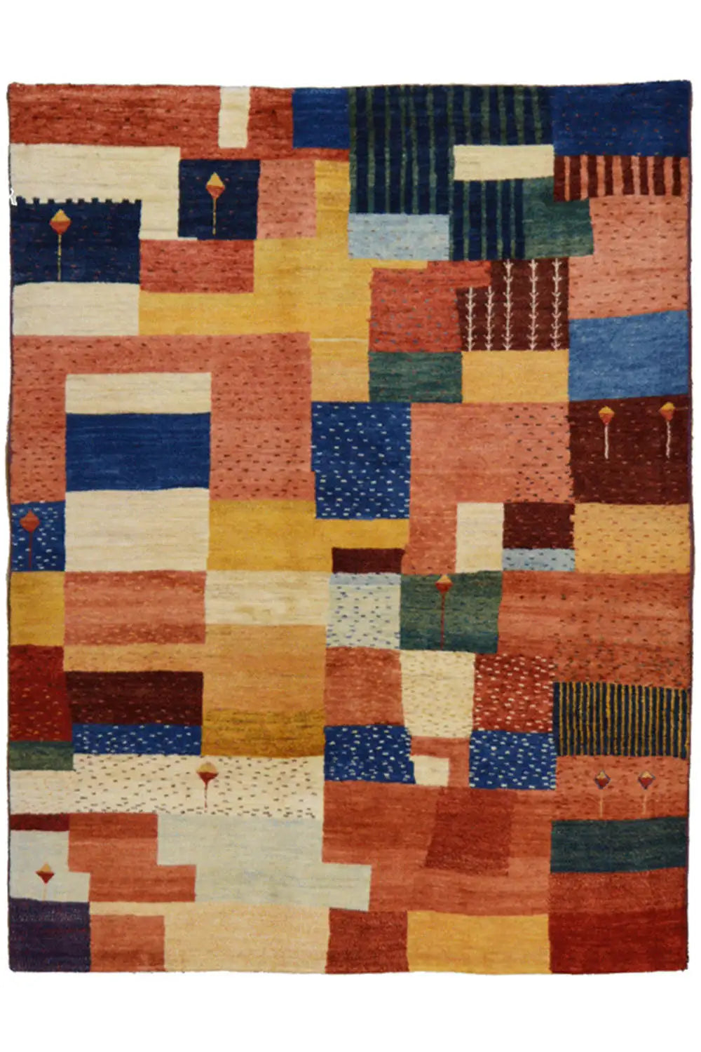 Patchwork rug with geometric blocks in blue, red, yellow, and cream, flat-woven