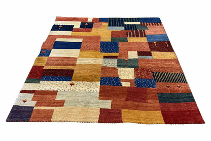 Rug with an abstract patchwork of rectangles and squares in blue, red, and yellow