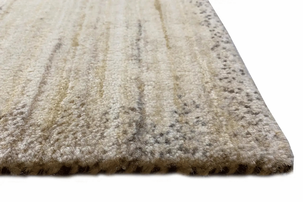 Gabbeh rug close-up: pile surface with a beige textured edge