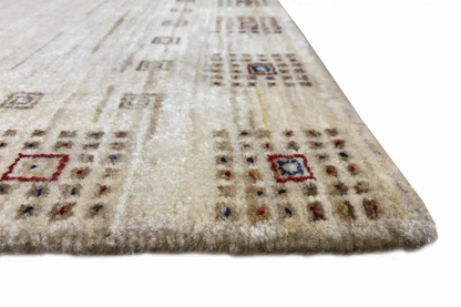 Close-up of Gabbeh rug 94x64 cm: beige surface with colorful square motifs