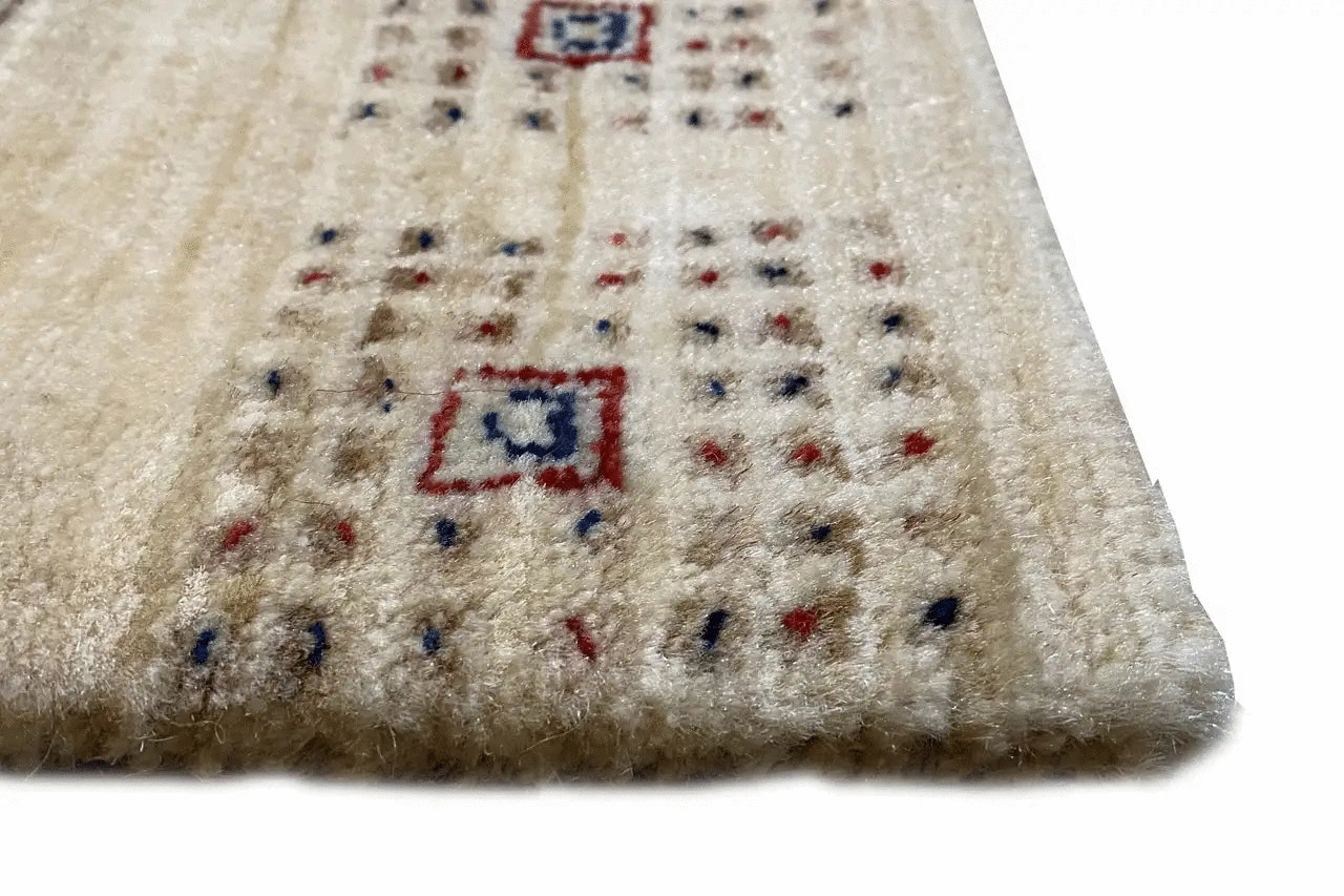 Gabbeh Lori rug detail: beige pile with small colorful motifs and borders