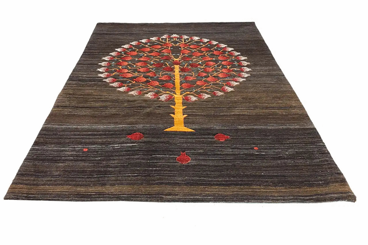 Dark brown rug with a large circular tree motif, a yellow column, and red dots
