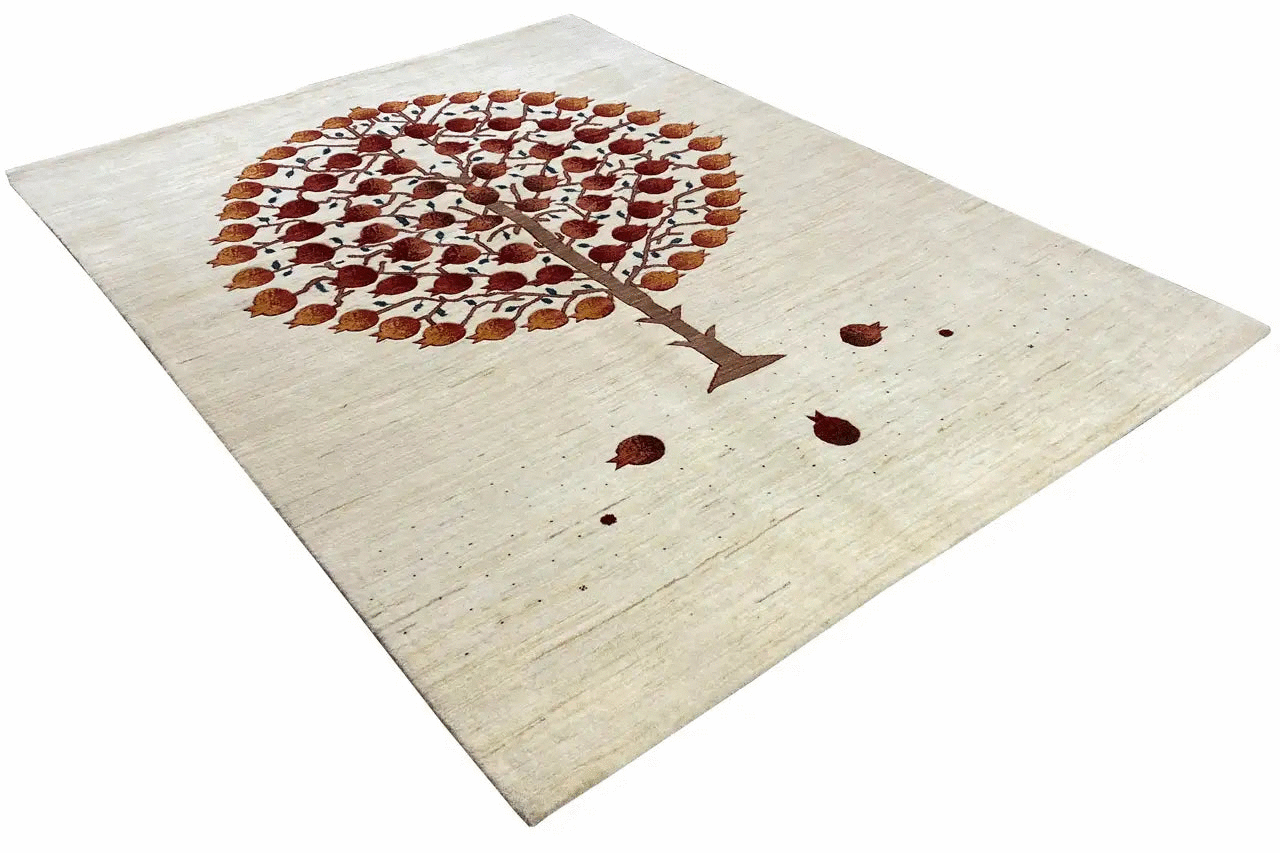 Gabbeh rug at an angle: treetop in brown-red, light-colored area with scattered dots