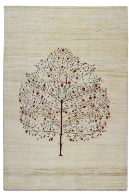 Beige Gabbeh rug with a central tree motif and delicate scattered red and blue ornaments