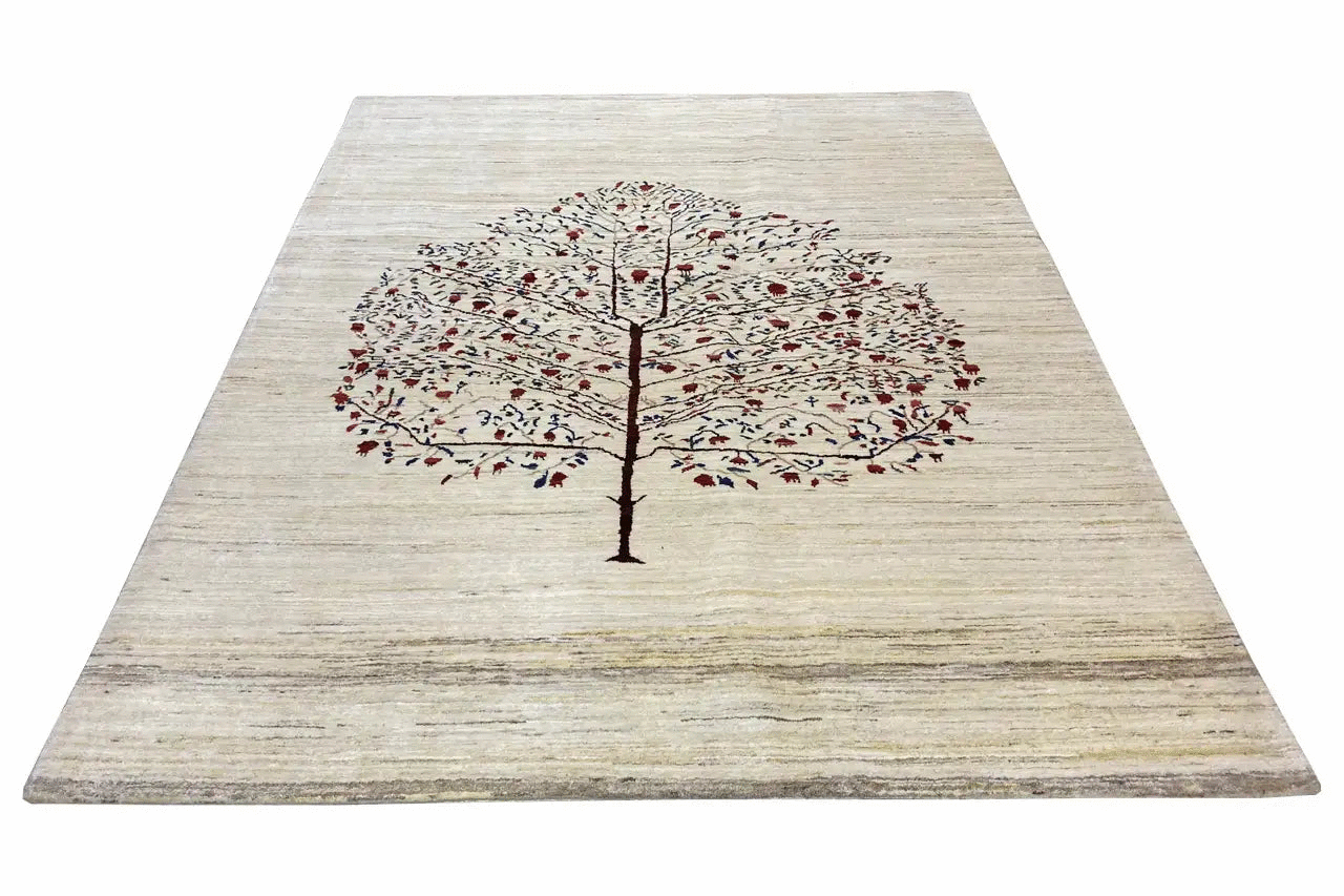 Beige Gabbeh rug with a large central tree and small red and blue patterns in the field