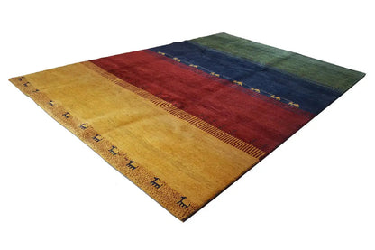 Gabbeh rug diagonal view with yellow field, red center, and dark blue stripes