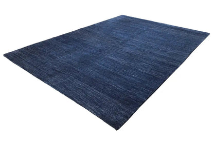 Blue carpet with a mottled texture, rectangular, laid diagonally