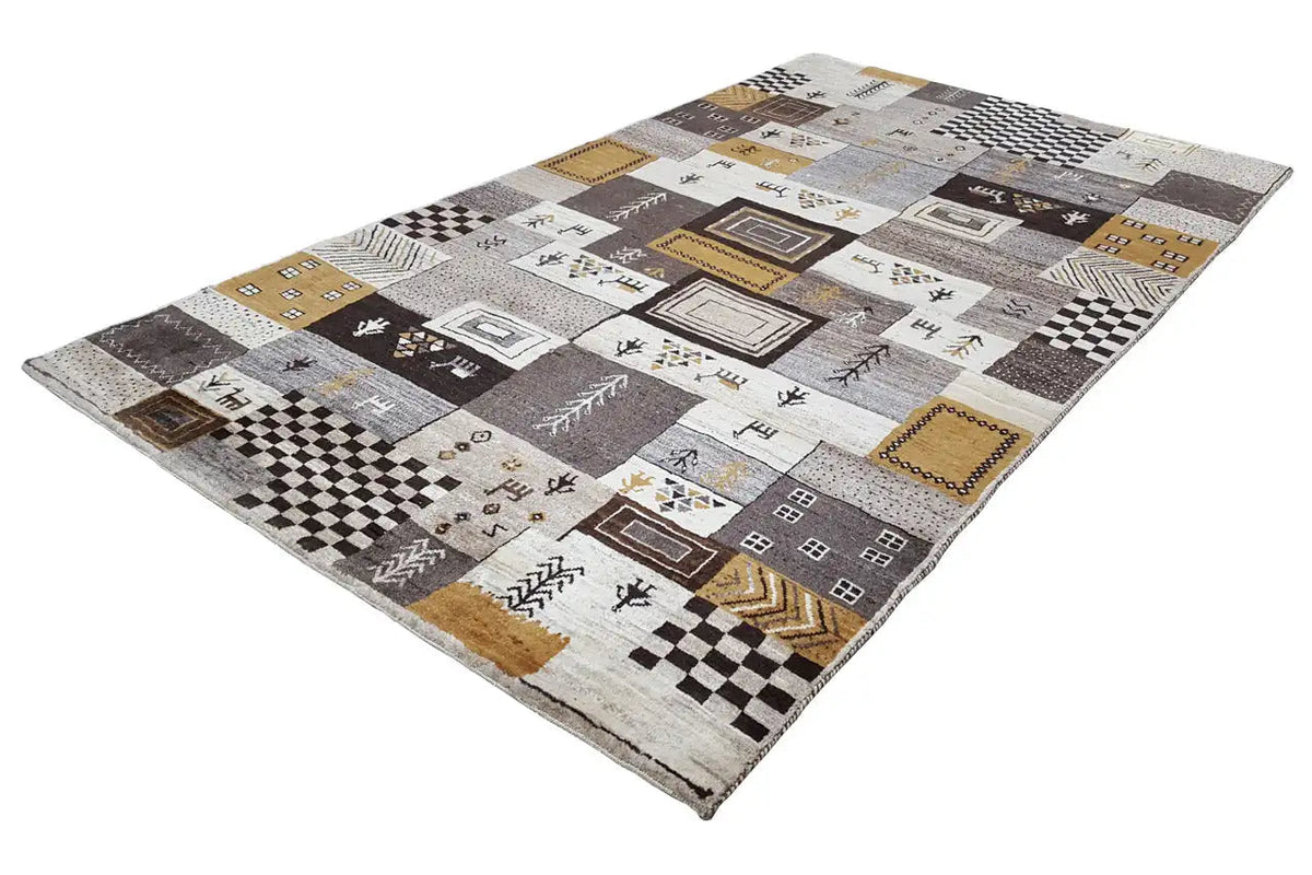 Gabbeh rug with diamond, zigzag, and checkered patterns, as well as golden-brown accents.