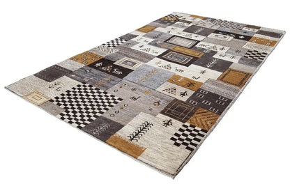 Gabbeh rug with dark squares, ornamental insets, and beige fields, trimmed in golden brown.