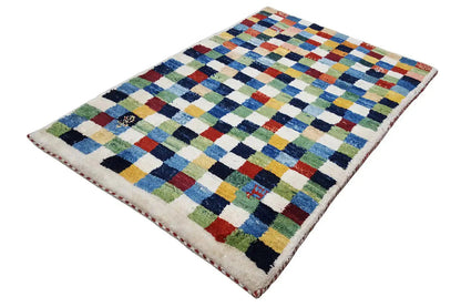 Rug with multicolored diamond and cross motifs, cream-colored background
