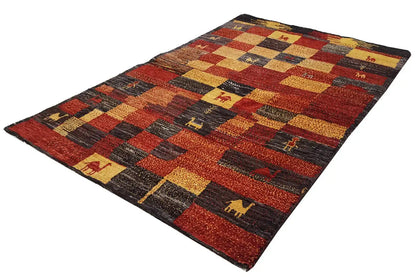 Gabbeh rug with checked patchwork design and animal motifs