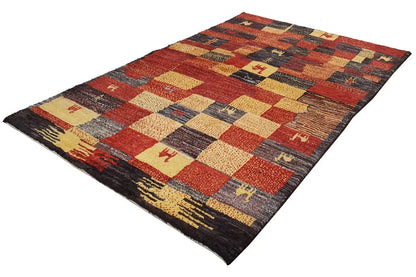 Gabbeh rug with square and striped patterns in reddish brown