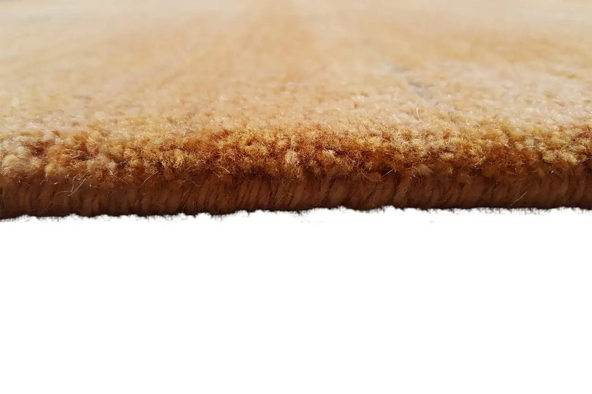 Gabbeh rug Gold, side view with dense brown-gold pile