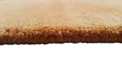 Gabbeh rug Gold, side view with dense brown-gold pile
