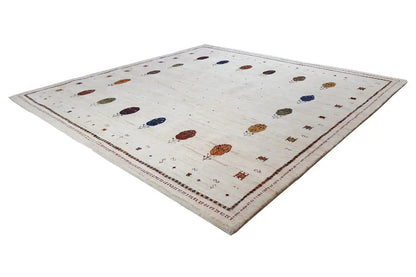 Rectangular Gabbeh rug, cream-colored pile with colorful medallions and decorative border