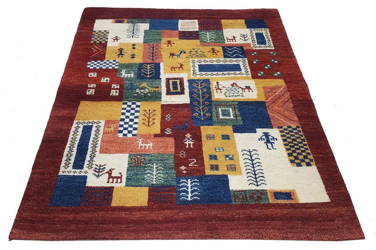 Gabbeh-Luri rug with colorful geometric patchwork panels and a red border