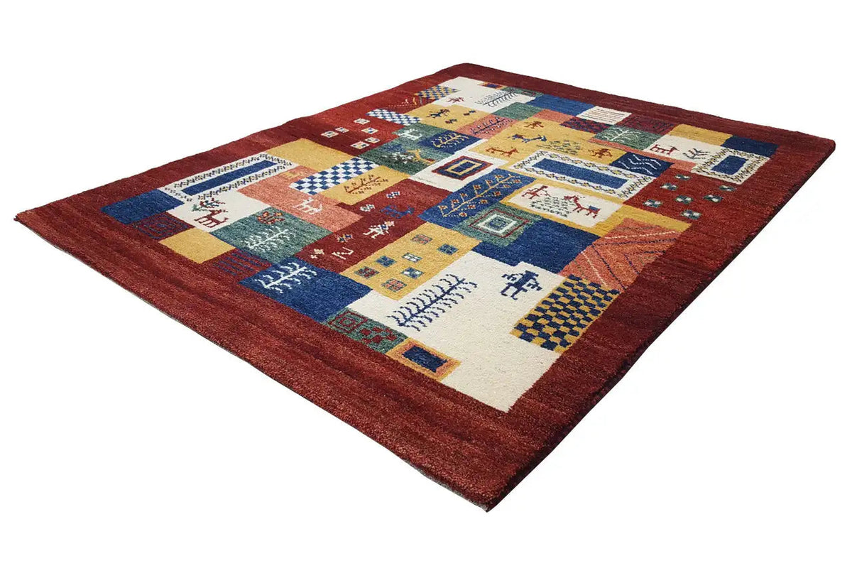 Gabbeh Luri rug with yellow-blue-red patchwork and small motifs in fields