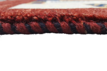 Close-up: red carpet edge with short fringe trim