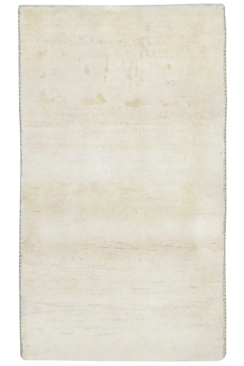 Rectangular beige rug with subtle, irregular color patches
