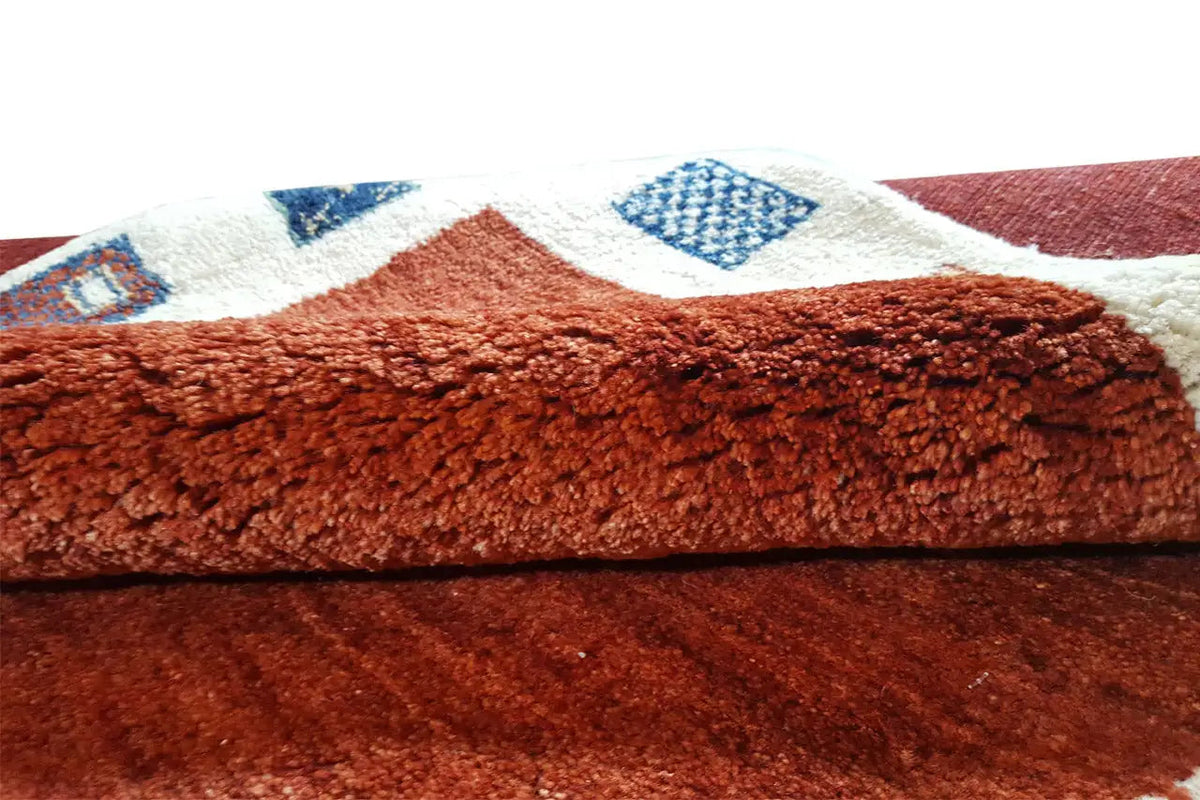 Gabbeh rug with red pile and visible rug texture
