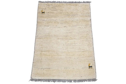 Gabbeh rug 87x59 cm, beige pile, fringes, small animal motifs along the sides