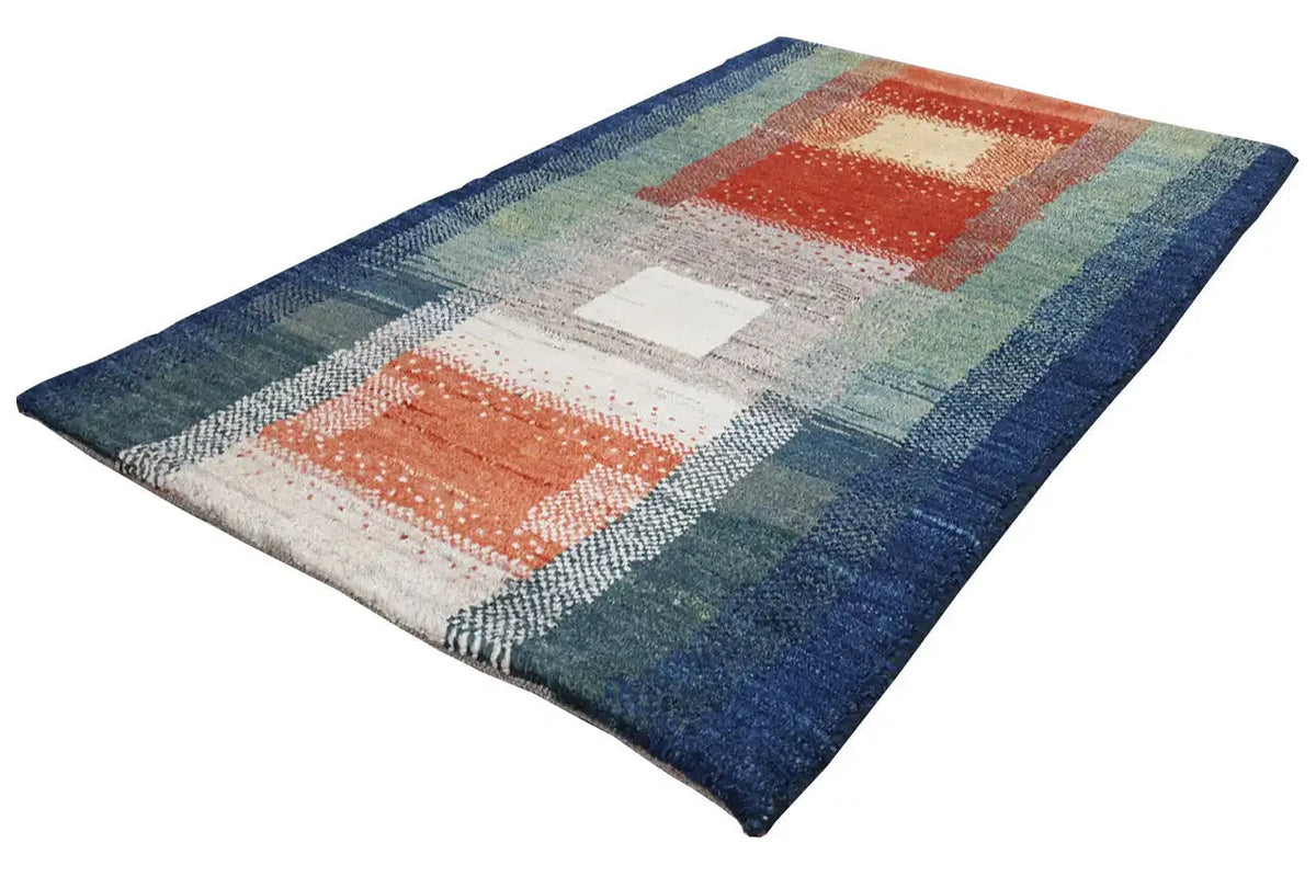 Gabbeh rug with an abstract block pattern in blue, green, red, and beige tones