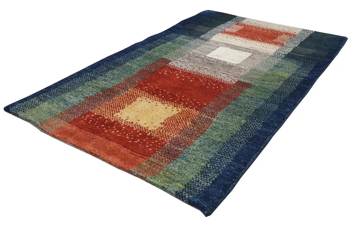 Gabbeh rug with large red and cream blocks in a geometric striped layout