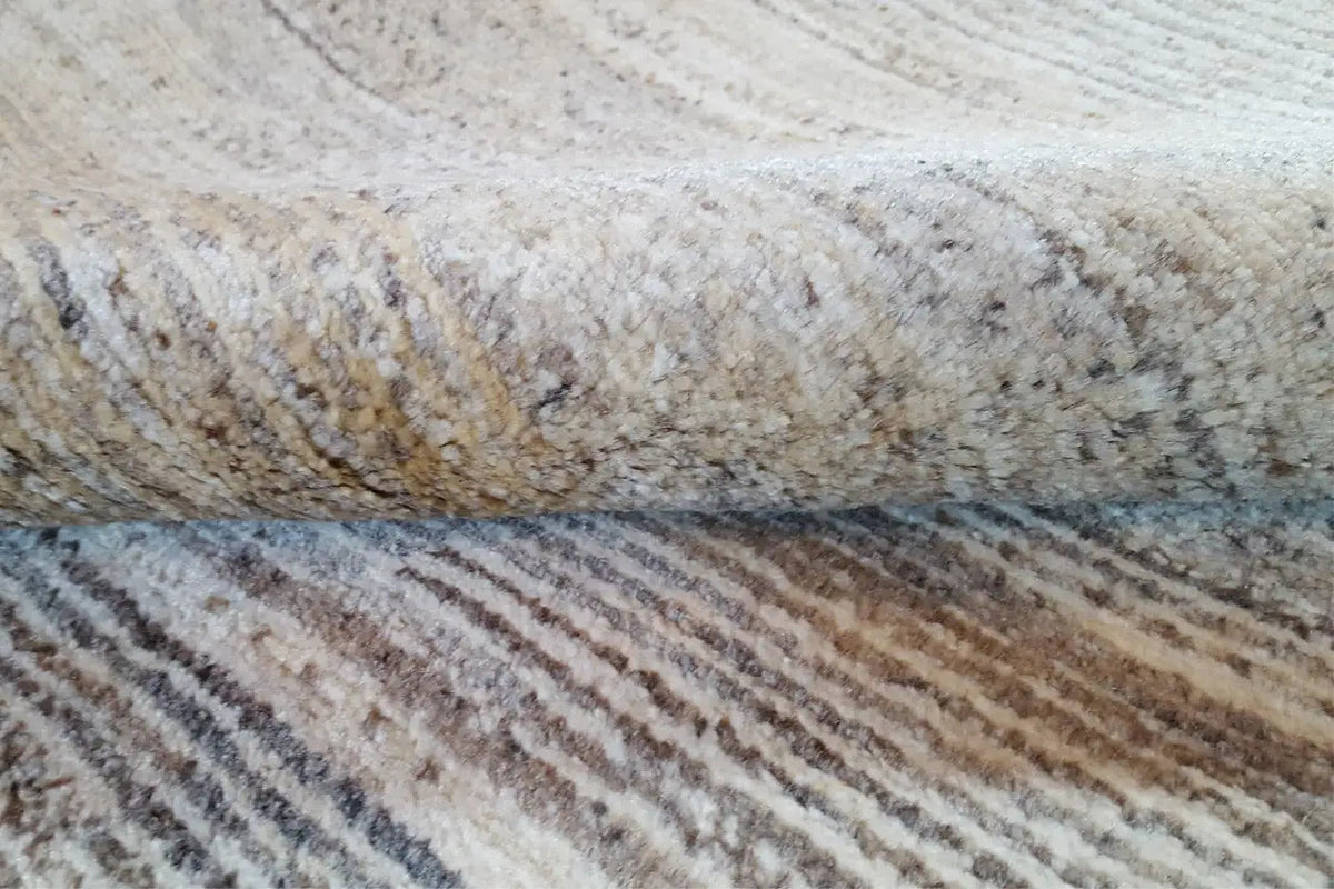 Gabbeh rug, detail with a beige and gray loop pattern