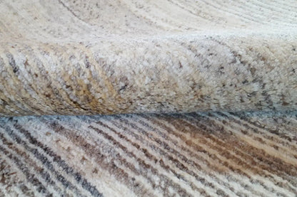Gabbeh rug, detail with a beige and gray loop pattern
