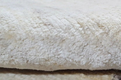 Gabbeh rug detail, cream-colored pile texture with an even surface