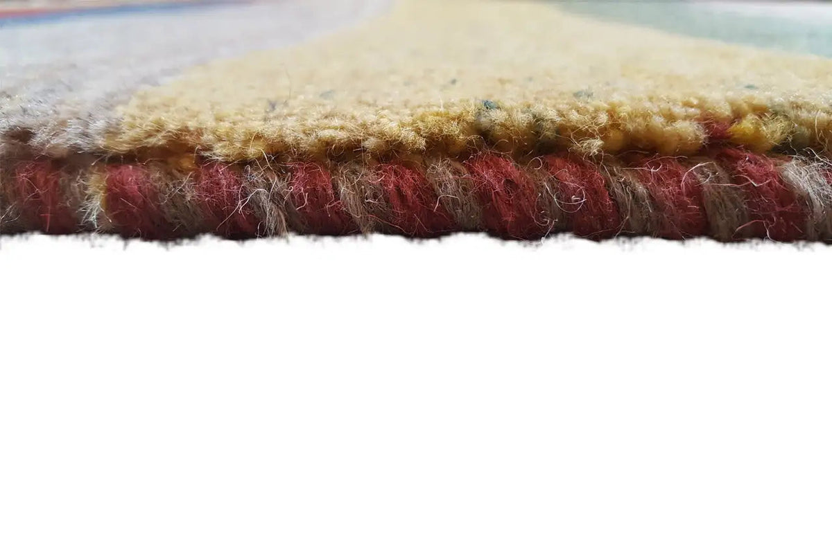 Close-up of the carpet edge: dense pile and colored binding