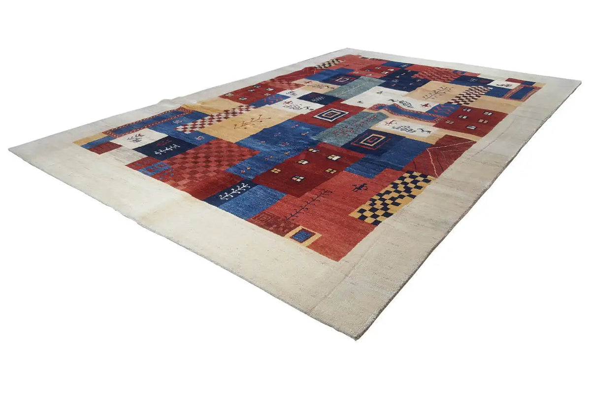 Gabbeh-Lori rug, diagonal view: patchwork design in red, blue, and cream