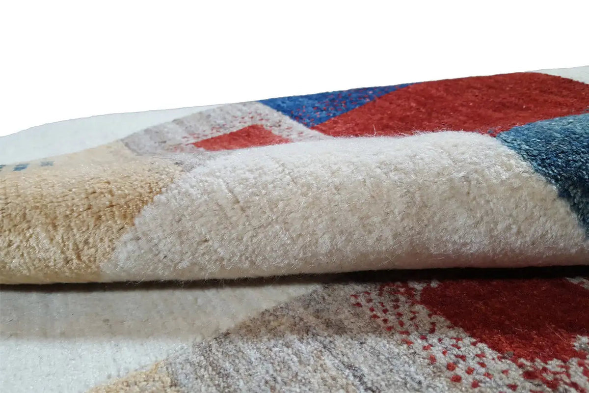 Close-up of a Gabbeh rug: thick pile with blue and red color blocks