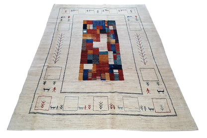 Gabbeh rug in light beige with a multicolored central pattern and border ornaments
