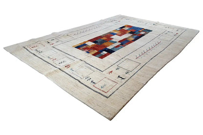 Gabbeh rug, beige base color, diagonal view with a geometric red-blue pattern