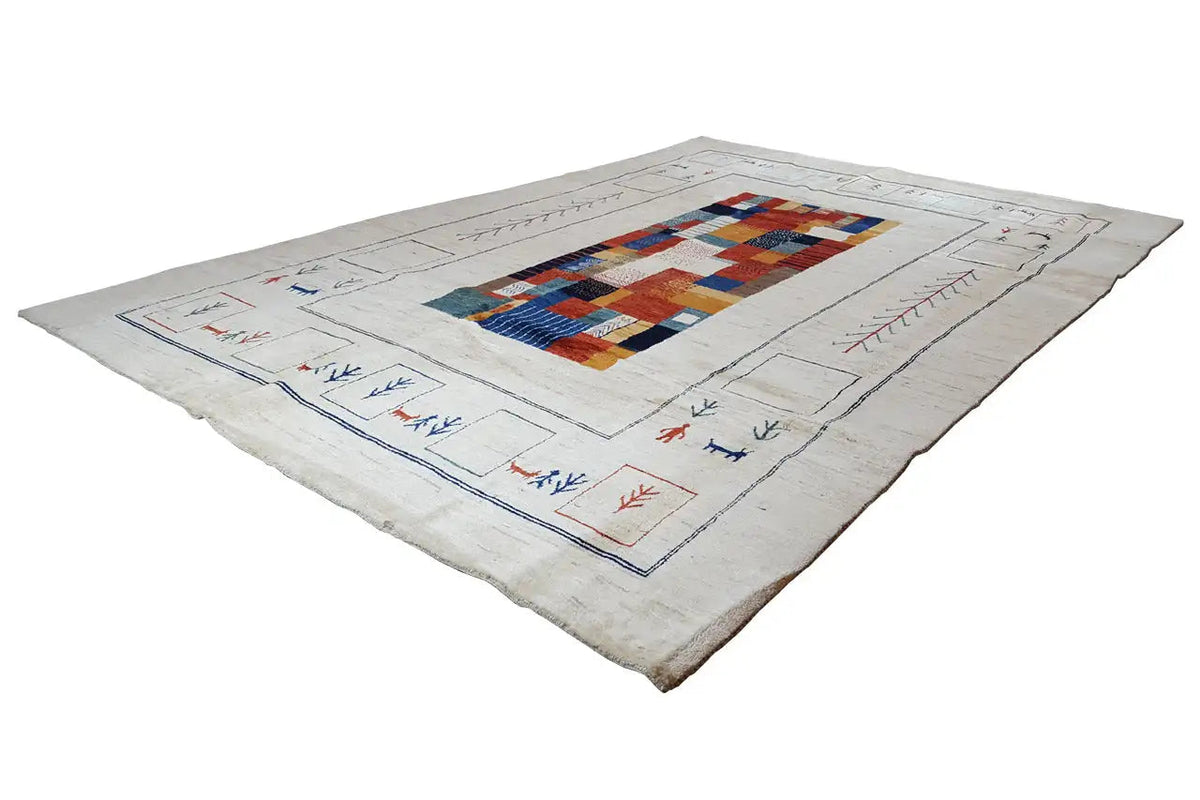 Gabbeh rug in light beige with a colorful diamond medallion and surrounding border