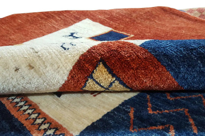 Gabbeh-Lori rug: close-up of the woven texture with short pile over a geometric pattern